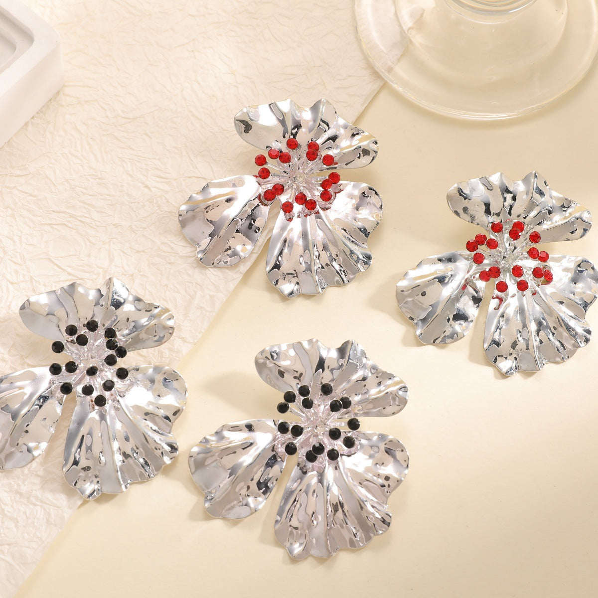 Women’s metal flower earrings with sparkling red accents Hapa Style