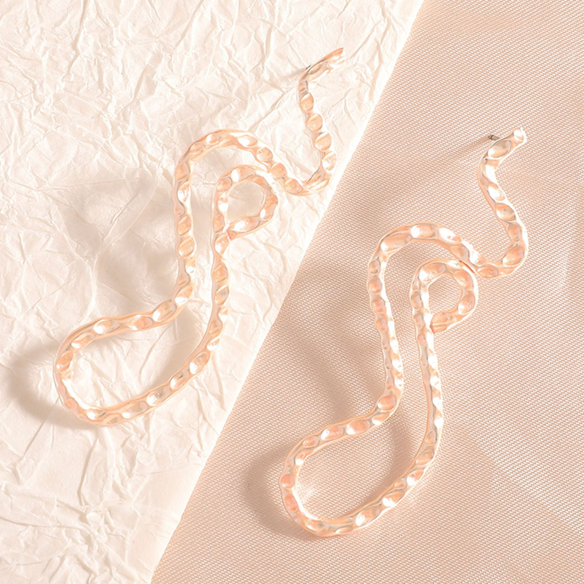 Ladies earrings in elegant wave pattern Hapa Style