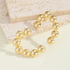 Women's bracelet with structured, golden beads Hapa Style