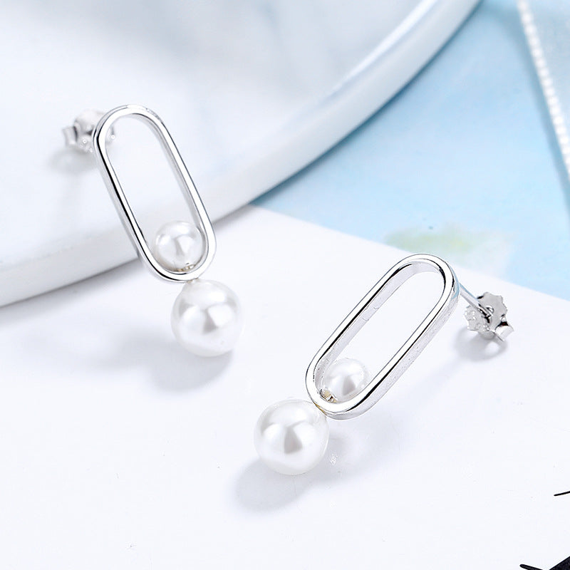 Women's stud earrings with modern oval design and elegant pearls Hapa Style