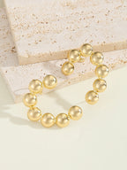 Women's bracelet with structured, golden beads Hapa Style