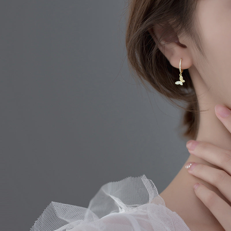 Ladies earrings with elegant butterfly design and sparkling details Hapa Style