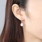 Ladies earrings with elegant zirconia decorations and pearl pendants Hapa Style