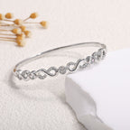 Women's bangle with elegant infinity pattern and sparkling zirconia Hapa Style