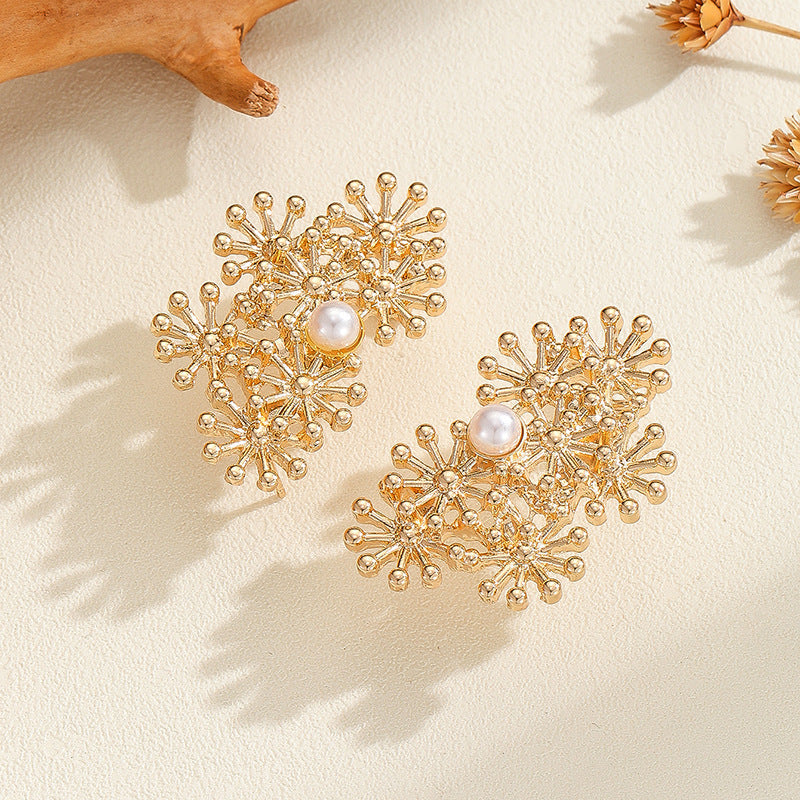 Women’s ear clips with elaborate flower design and pearl accent Hapa Style