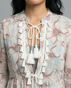 Women’s beach dress with high collar and romantic floral pattern