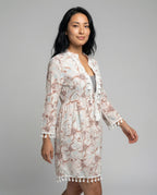 Women’s beach dress with high collar and romantic floral pattern